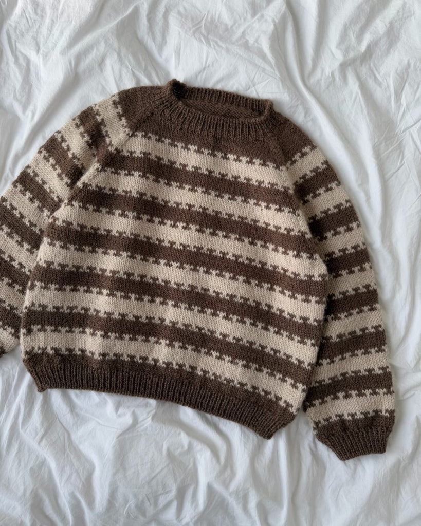 Liggebillede af brun og hvid Key Sweater Junior